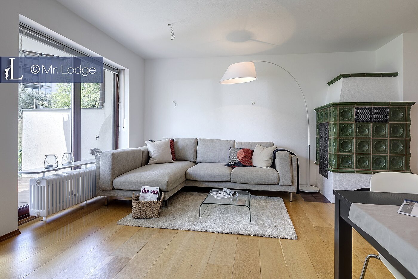 Appartement au rez-de-chaussée avec 2 pièces | München-Harlaching | 1704ML6 | Wohnzimmer mit Kachelofen