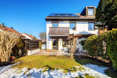 Maison d'angle mitoyenne avec jardin et garage